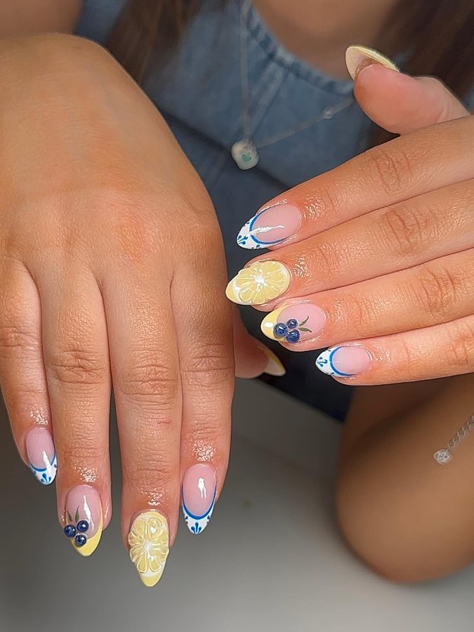 Blue and lemon French tips on almond nails